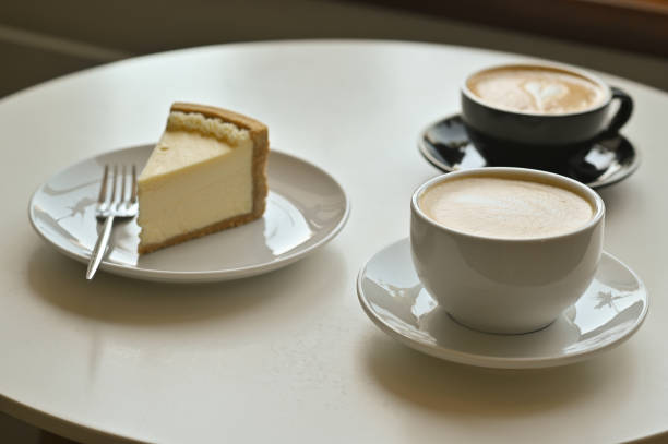 istock two cups of coffee latte with cake 1909151097