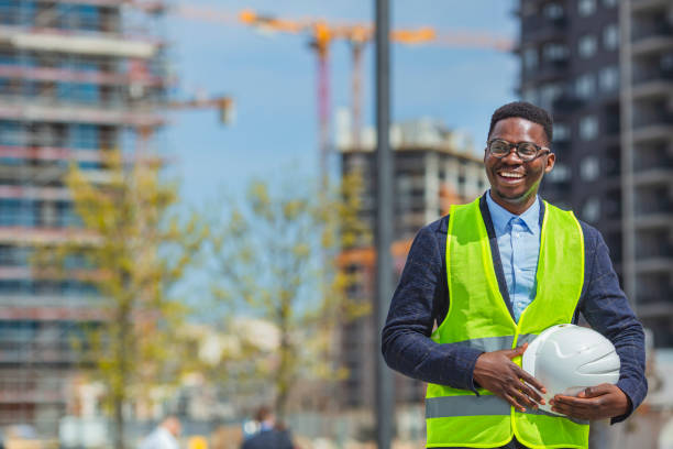 istock Portrait of a happy construction worker at a building site. 1909162333