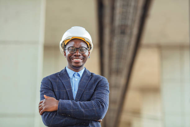 istock Successful mature civil engineer at construction site with copy space. 1909162893