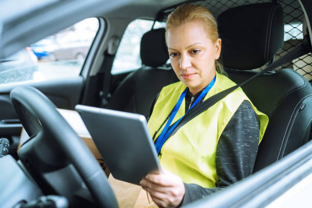 istock Delivery courier in the car 1909179975