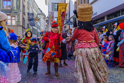 Oberkirch, Germany - February 12, 2023: Traditional carnival parade with traditionell masks and costumes