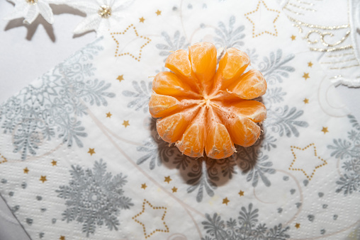 A closeup of a ripe juicy tangerine, a traditional festive fruit in Poland during the Christmas season