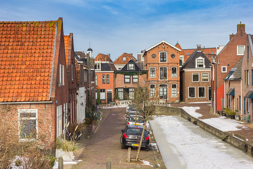 Little houses at the frozen canal of Dokkum, Netherlands