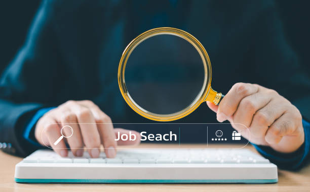 istock Website for business work research technology or hunting job communication. Student or businessman use magnifying glass and computer keyboard to search information. Success internet marketing web. 1909256330