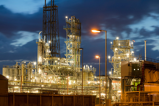 Modern petrochemical industry and oil refinery factory at dusk, Netherlands, Benelux, Europe.