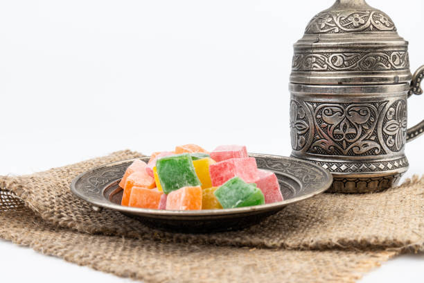 istock Turkish Coffee with Turkish Delight on authentic metal plate, isolated on white background 1909271308