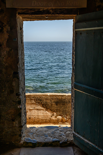 Goree, Senegal - March 01, 2023 : View from inside the House of Slaves, capturing the iconic 'Door of No Return' open to the Atlantic Ocean on Goree Island, Senegal, a symbol of the slave trade.