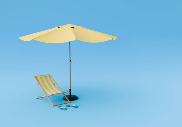istock Beach Chair and Umbrella on blue studio background 1909370514