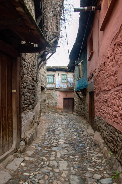 istock narrow street in old town 1909373633