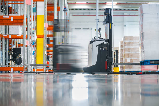 istock Automated forklifts in a warehouse 1909377270