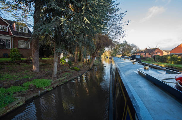 istock Narrowboat on a British canal in rural setting 1909385725