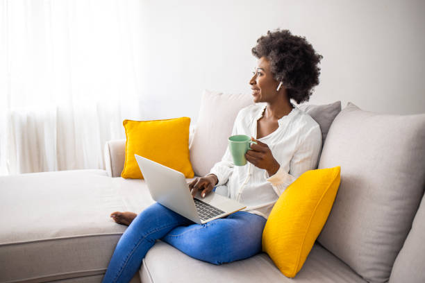 istock Happy young beautiful Freelancer woman using laptop computer 1909386769