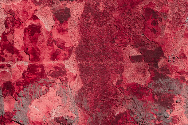 istock Red grunge wall with deep scratches and chips. Various variations of abrasions. 1909401375