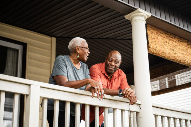 istock Relaxed Black couple standing on verandah and talking 1909419814