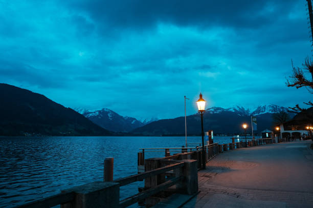 istock Street lamp with Alps lake 1909470910