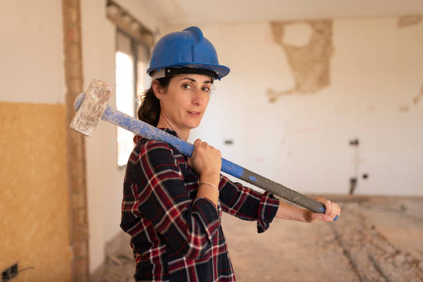 Woman with heavy demolition hammer