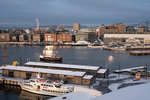 Oslo, Norway. December 7, 2023. A view of the Oslo harbor seen from Akershus fortress on a cold winter day in December.