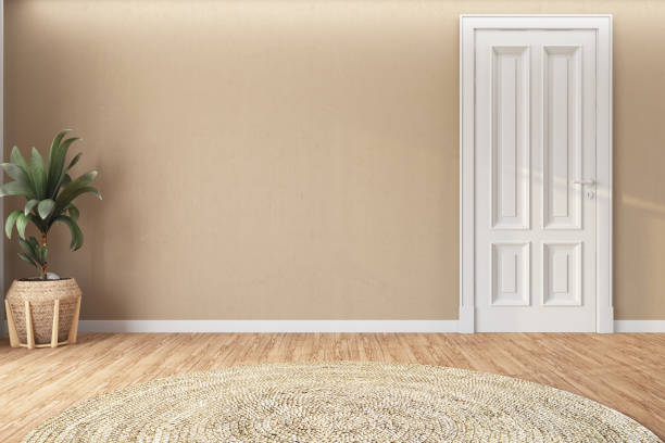 istock Empty Beige Wall with a Door and Indoor Plant 1909510956