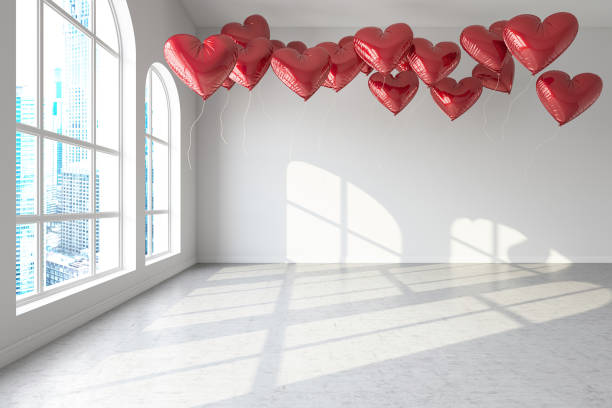 istock Heart Shaped Balloons in a White Interior 1909517774