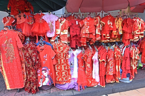 Red Chinese Costumes Clothes on Hangers.