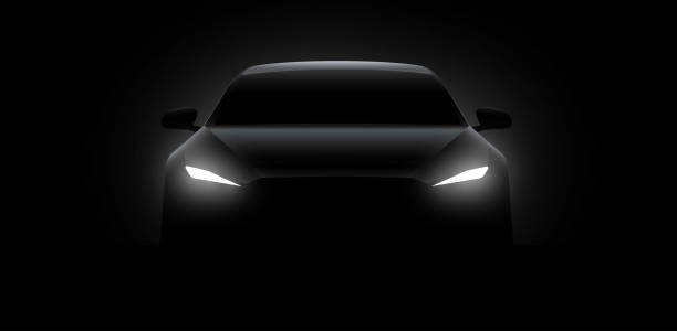 istock Front car silhouette with rear white lights on dark black background, wallpaper, banner template. Vector illustration 1909551950