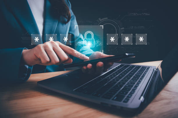 istock Woman protecting personal data on smartphone virtual screen interfaces. Cybersecurity to protect data, information security, encryption, lock icon and internet network security technology concept. 1909556550