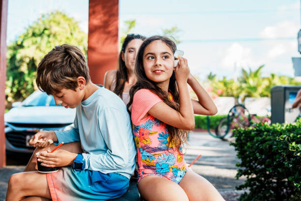 istock Family enjoying Hawaiian shave ice while on vacation 1909581527