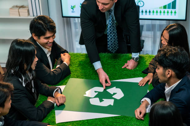 istock Recycle icon on meeting table with business people. Quaint 1909622057