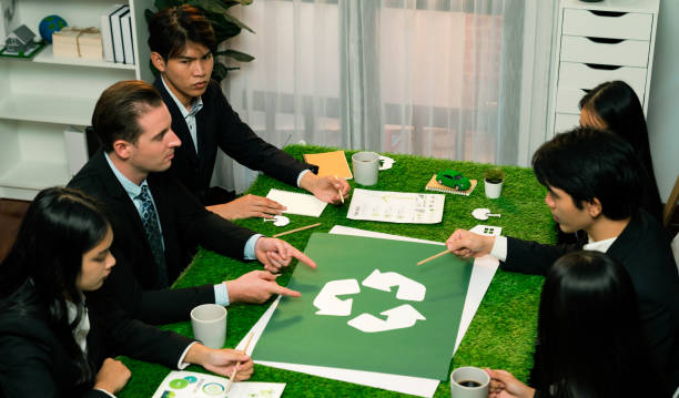 istock Recycle icon on meeting table with business people. Quaint 1909625178
