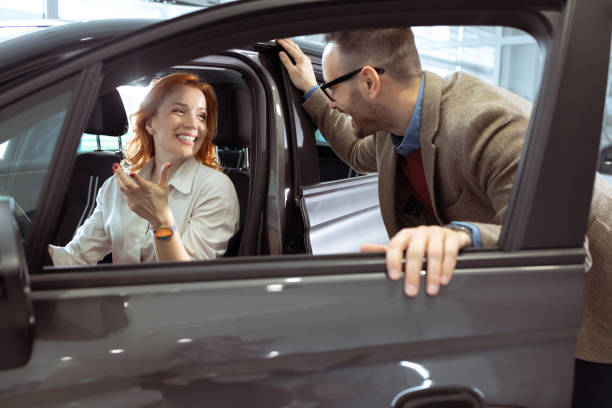 istock Couple buying their new car 1909626142