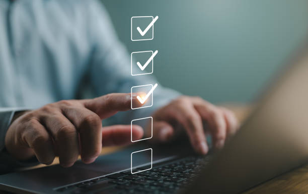 istock Business performance checklist, businessman using laptop doing online checklist survey, filling out digital form checklist, take an assessment, questionnaire, evaluation, survey, online exam. 1909628279