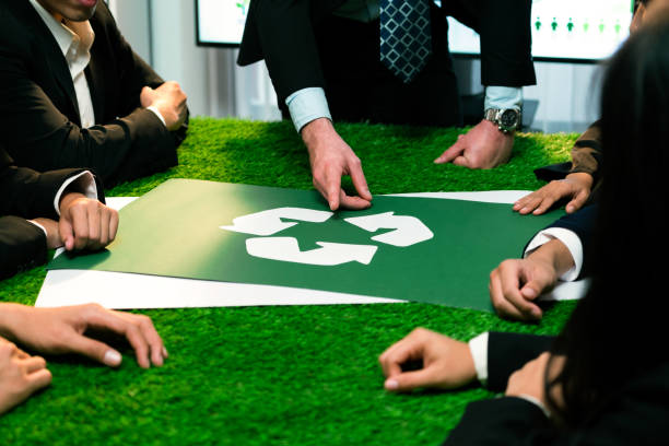 istock Recycle icon on meeting table with business people. Quaint 1909638302