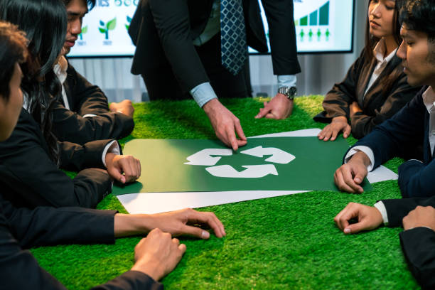 istock Recycle icon on meeting table with business people. Quaint 1909642516