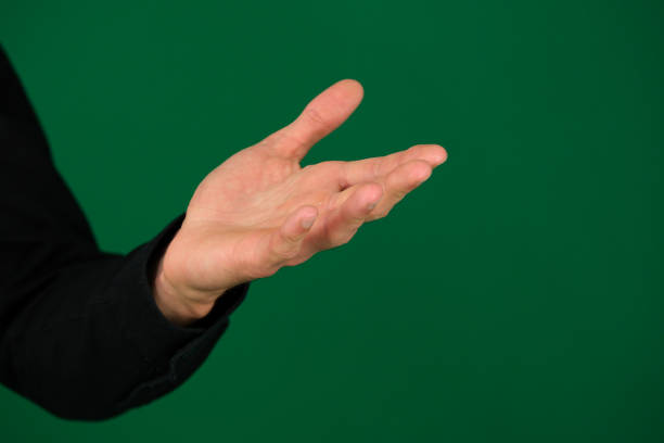 istock Hand men isolated on green background 1909677048