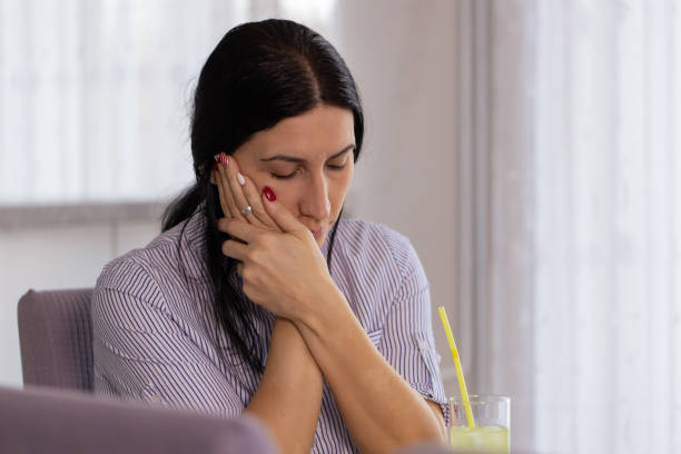 istock Woman at home with a toothache 1909688663