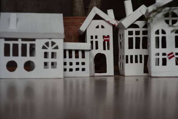still life with white cardboard houses, preparation for Christmas, interior element, home decor
