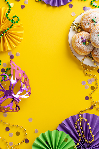 Birthday, party, celebration, New Year or Christmas celebration concept. Colored confetti and streamers falling against pastel colored blue background. High resolution 42Mp studio digital capture taken with Sony A7rII and Sony FE 90mm f2.8 macro G OSS lens