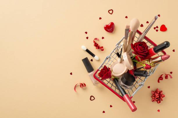 Valentine's beauty finds: top view of pushcart brimming with love-themed purchasesâlipstick, brushes, eyeshadow, heart confetti, serpentine and rosesâarranged on pastel surface, space for your words hallazgos de belleza de san valentín: vista superior de un carrito repleto de compras con temas de amor: lápiz labial, pinceles, sombra de ojos, confeti de corazón, serpentina y rosas, dispuestos en una superficie pastel, espacio para sus palabras