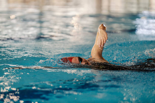 istock A swimmer is swimming crawl style in pool. 1909727600