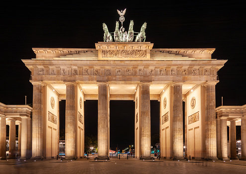 Classic view of famous Brandenburger Tor (Brandenburg Gate), one of the best-known landmarks and national symbols of Germany, in twilight during blue hour at dawn, Berlin, Germany