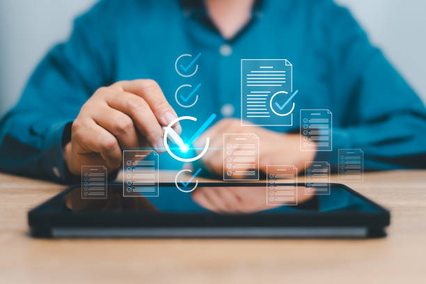 istock Document and checklist management,Top service quality control  concept, Businessman make evaluation form online to measure result in high quality, Best products, QA, QC, Standardization, certification 1909737544