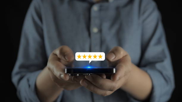 istock Businessman using tablet with popup five-star icon for feedback review satisfaction service, Customer service experience and business satisfaction survey. Good product and service, best quality 1909746918