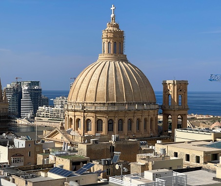 Sunny daytime shot of The Basilica of Our Lady of Mount Carmel is a Carmelite Roman Catholic minor basilica dedicated to Our Lady of Mount Carmel, located in Valletta, Malta. It is one of the main churches of Valletta, and it forms part of a UNESCO World Heritage Site.