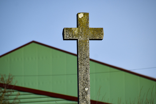 A Christian cross symbol made of stone