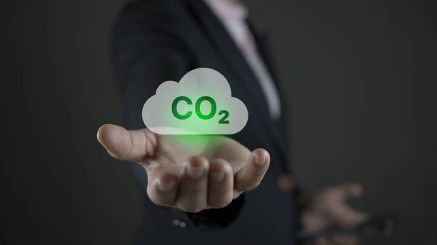 istock Educe CO2 emission concept in the hand for environmental clean and environmentally friendly environment without carbon dioxide emissions. Reduce CO2 emission concept. 1909856853