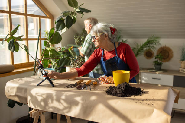 istock Senior woman vlogging on gardening 1909863673