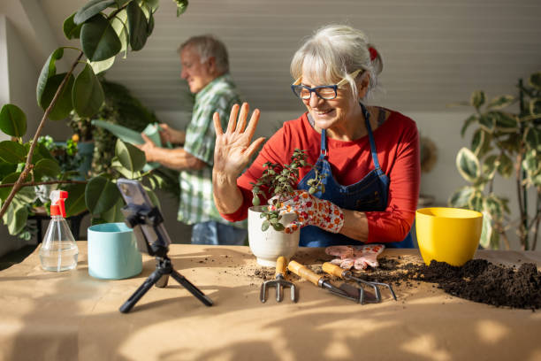 istock Senior woman vlogging on gardening 1909864724