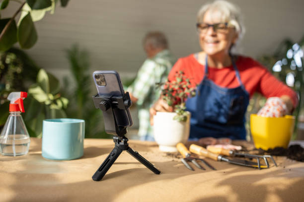 istock Senior woman vlogging on gardening 1909865253