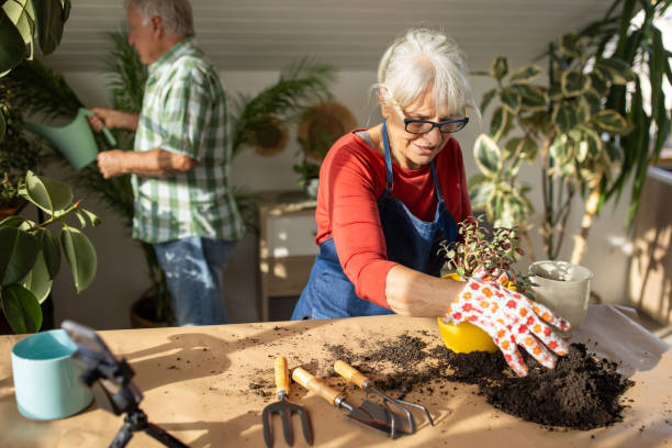 Senior woman vlogging on gardening