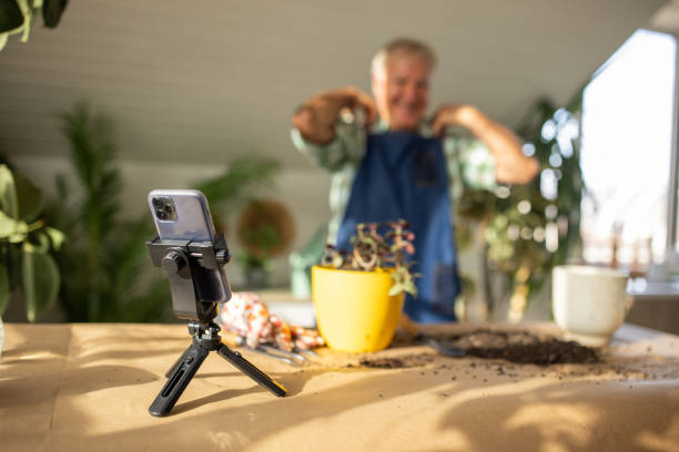 istock Senior man vlogging on gardening 1909867895